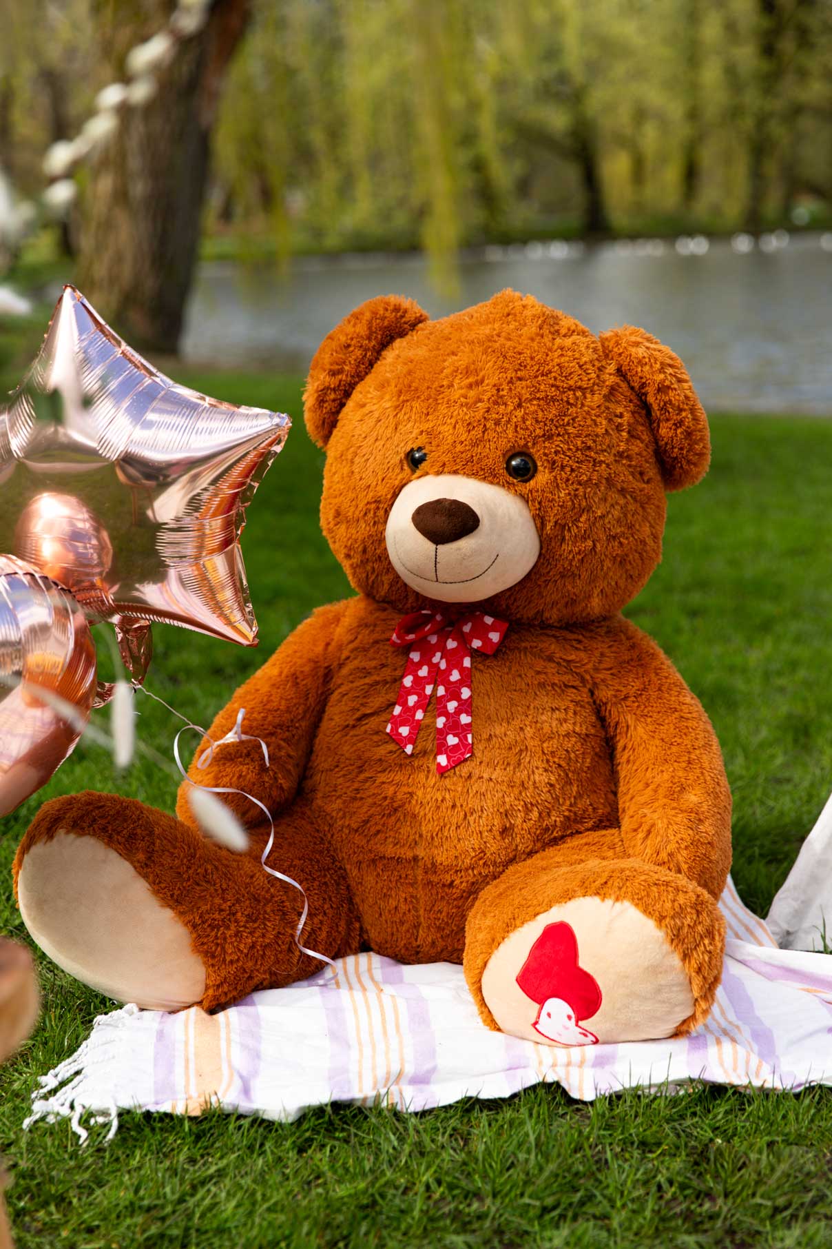 big teddybear xxl in park at luxury picnic, as decoration