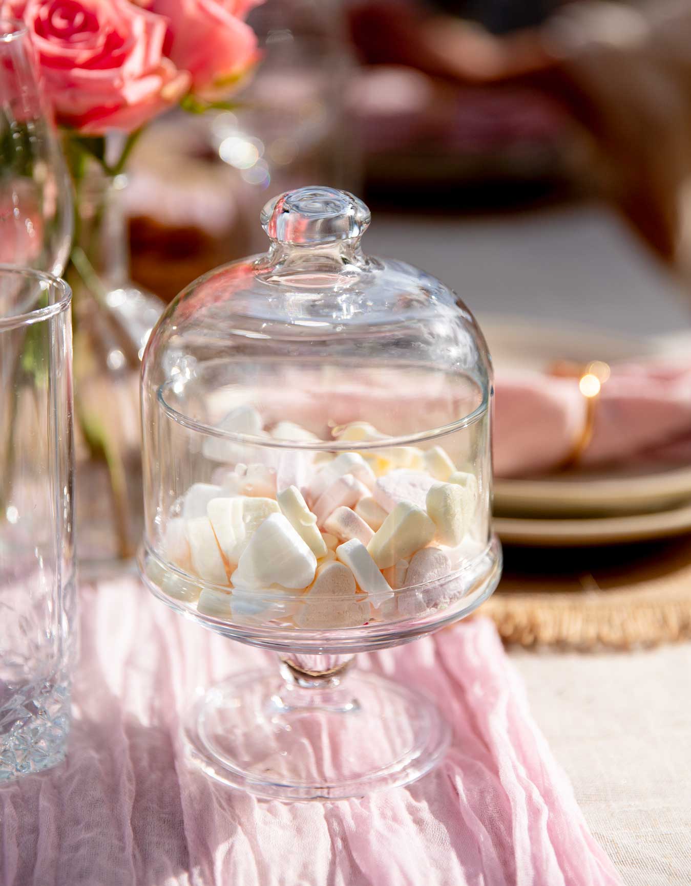 glass snack server with heart sweets at a luxury picnic